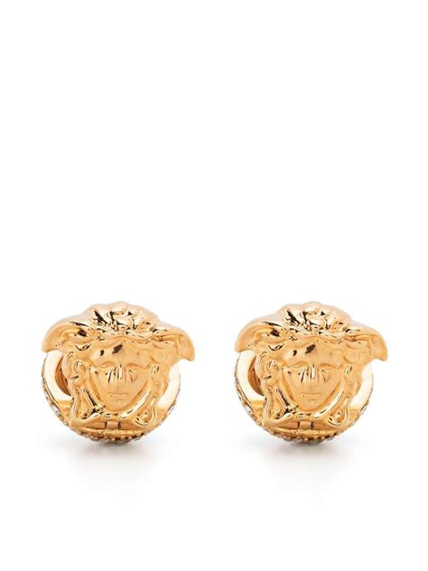 Aretes de Versace .